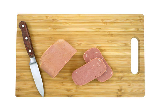 Luncheon Meat Sliced On Cutting Board