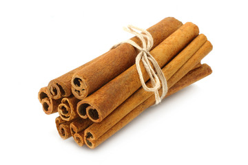 Bunch of cinnamon sticks on white background
