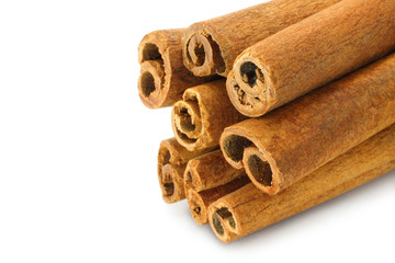 Bunch of cinnamon sticks on white background