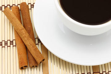 Cup of coffee with chocolate and cinnamon