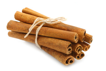 Bunch of cinnamon sticks on white background