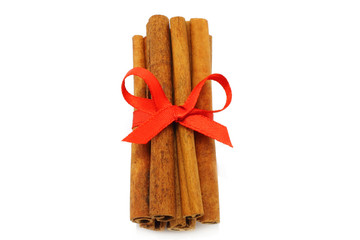 Bunch of cinnamon sticks with red bow
