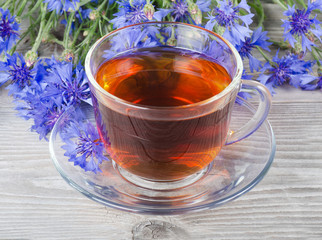 Glass cup with a cornflower tea