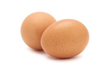 Two fresh brown eggs