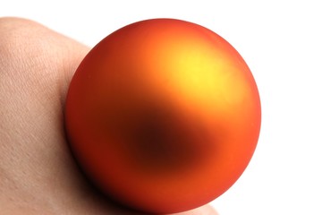 orange sphere ina  hand