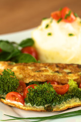 Broccoli and tomato omelette with mashed potato