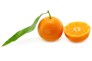 Tangerine with leaf and a part of tangerine