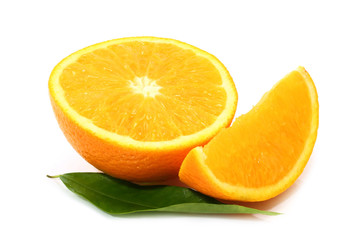 Cut orange with leaf on white background