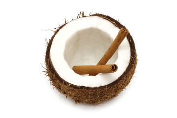 Fresh coconut with cinnamon sticks