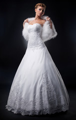 Spectacular pretty bride blonde in nuptial white dress