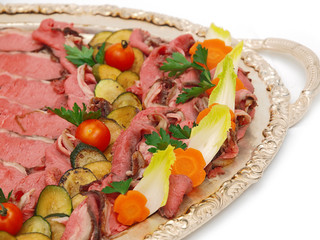 roast beef on silver platter