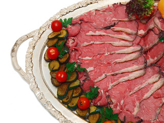 roast beef on silver platter