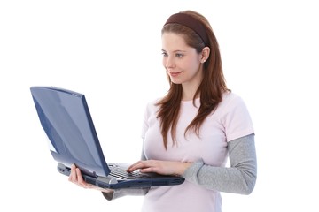 Naklejka premium College student using laptop smiling