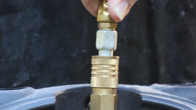 Unhooking Air Compressor Hose Coupling