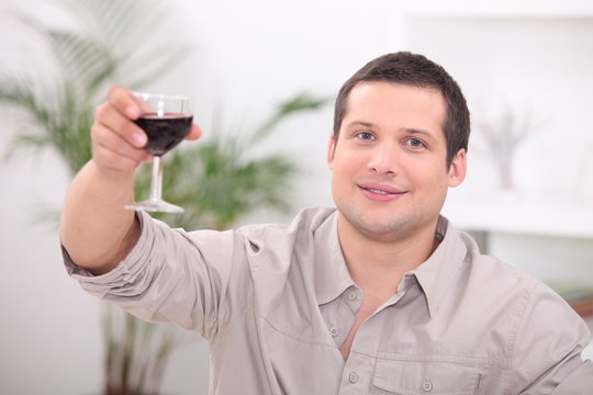 Man drinking wine alone