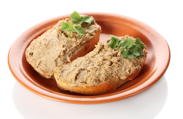 Fresh pate on bread on brown plate isolated on white