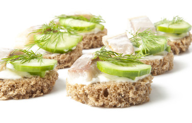 sandwiches with herring, cucumber and dill