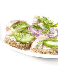 sandwiches with herring, cucumber and dill