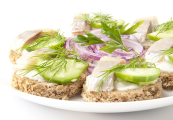 sandwiches with herring, cucumber and dill