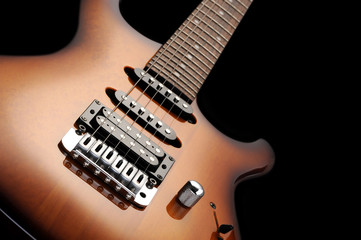 Fototapeta na wymiar close up of a elelctric guitar on dark background