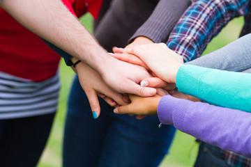 Multiracial Students with Hands on Stack