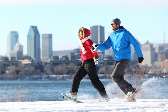 Winter Couple Fun On Snowshoe In Montreal