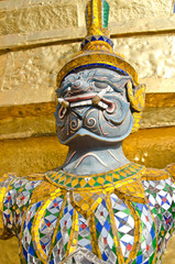 Giant lifting the base of the pagoda at Wat Phra Kaew, Thailand