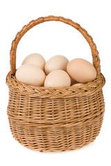 eggs and basket isolated on white