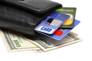 credit cards and dollar banknotes