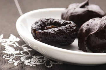 Dried plums in chocolate