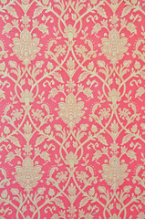 flower pattern in traditional Thai style art on wall of the temp