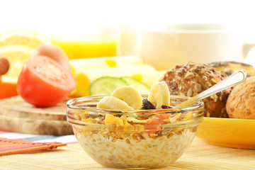 Breakfast including rolls, egg, cheese, coffee and orange juice