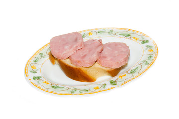club sandwiches with ham and cheese on a plate close-up