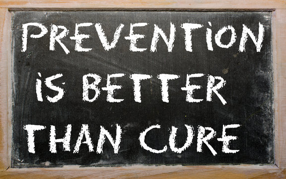 Proverb "Prevention is better than cure" written on a blackboard
