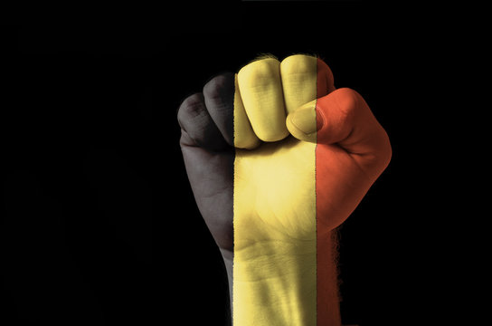Fist painted in colors of belgium flag