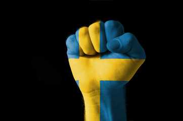 Fist painted in colors of sweden flag