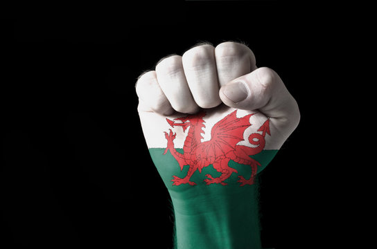 Fist painted in colors of wales flag