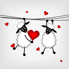 two sheep with red hearts