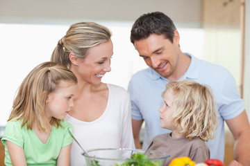 Obraz na płótnie Canvas Happy family together in the kitchen