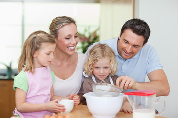Obraz na płótnie Canvas Family preparing dough