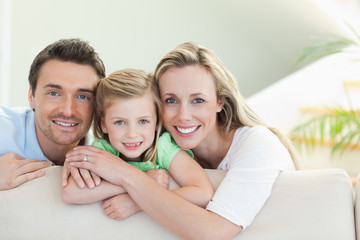 Parents with daughter on the couch