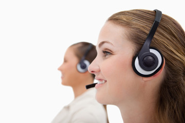 Side view of operators using headsets