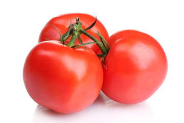 Ripe red tomatoes isolated on white