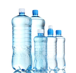 Group plastic bottles of water isolated on white