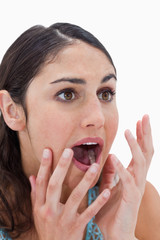 Fototapeta premium Portrait of a shocked young woman gesturing
