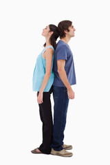 Naklejka premium Portrait of a couple standing back to back