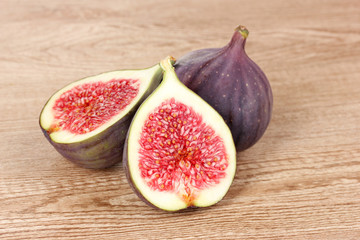 Ripe figs on wooden background