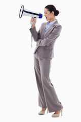 Fototapeta premium Portrait of a businesswoman shouting through a megaphone
