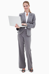 Smiling bank employee with laptop