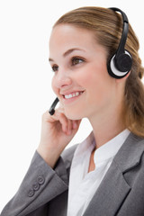 Side view of listening call center agent with headset on